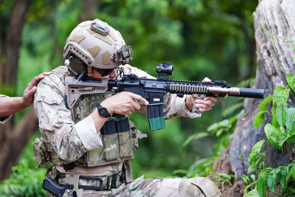 types of tactical helmets - soldier with rifle gun