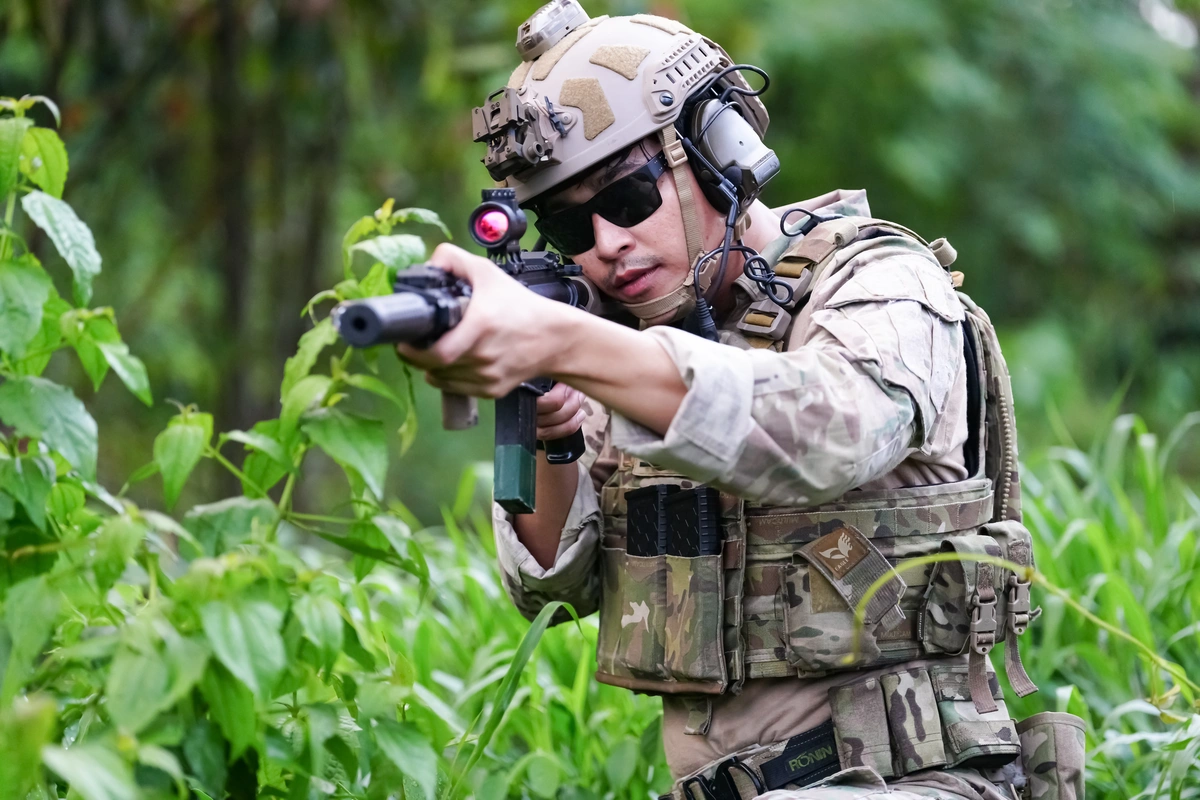 types of tactical helmets - soldier with rifle gun