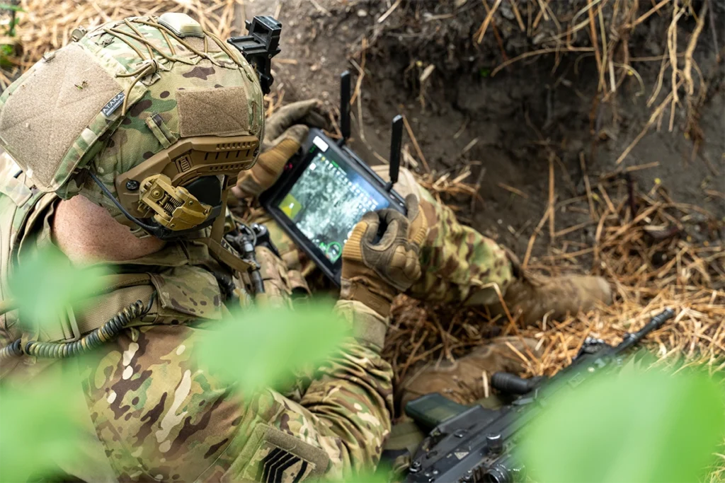 soldier with tablet in field position – tactical essentials with technology