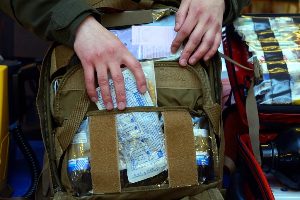 open tactical first aid kit with bandages and medical supplies
