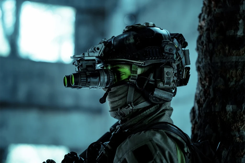 operator with night vision and warfare equipment during a night operation