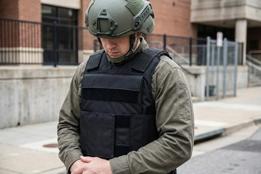 Man in civilian clothes and helmet wearing bulletproof vests for local governments as part of crisis preparation